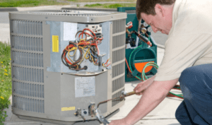 man working on ac repair melbourne fl