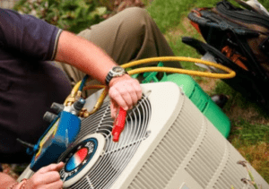 tech repairing outdoor ac unit