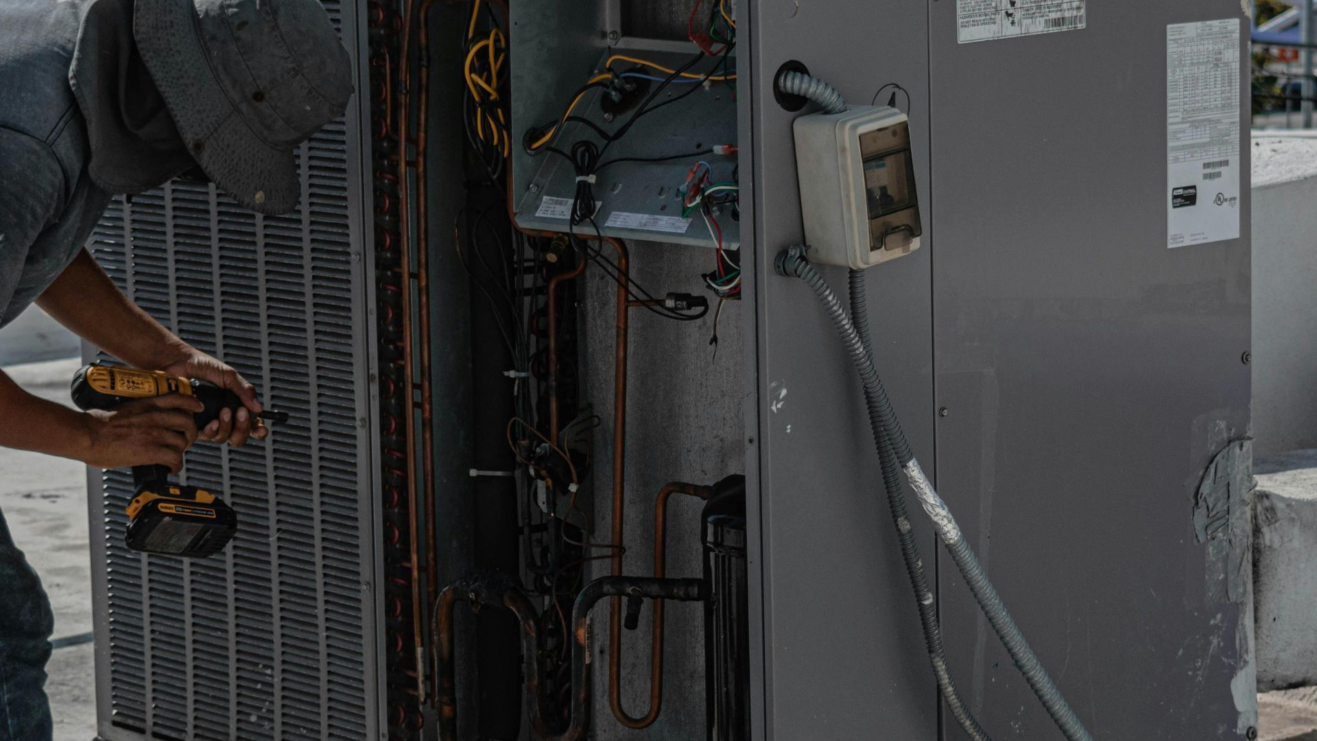 Florida HVAC technician performing fall AC maintenance