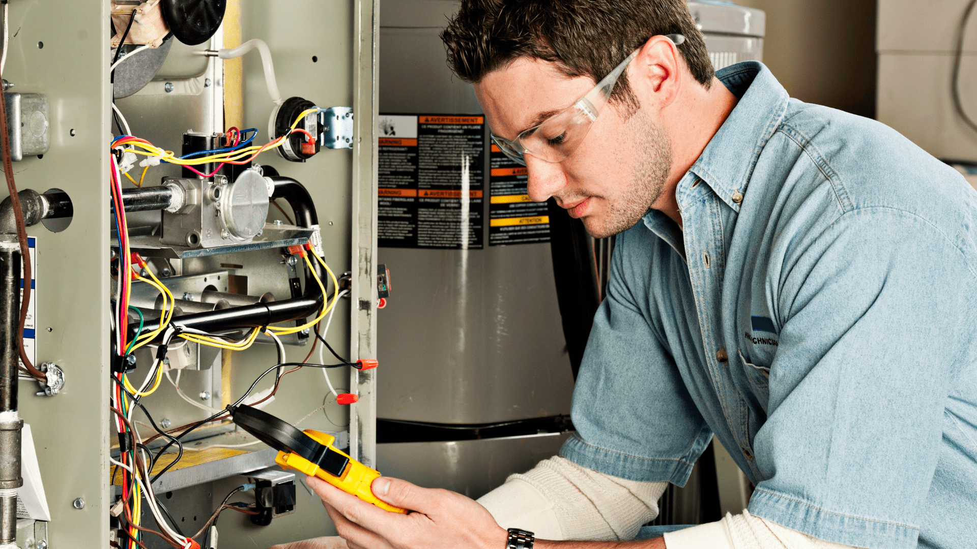 hvac tech working on gas furnace